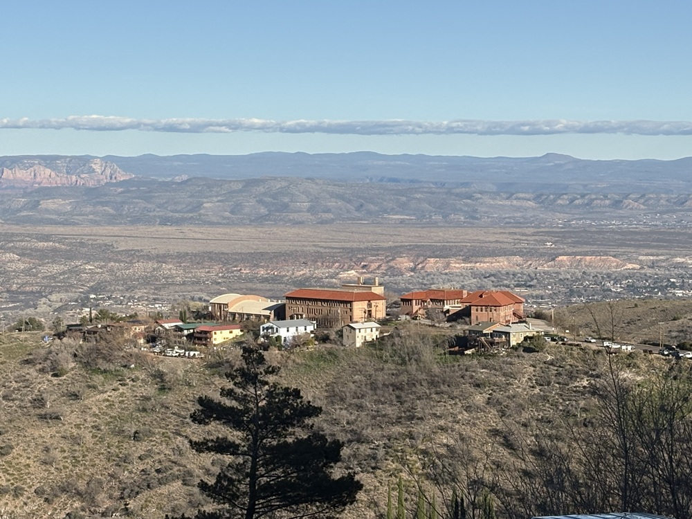 Craig Spiesman photo featuring buildings on a hillside with expansive valley scenery beyond
