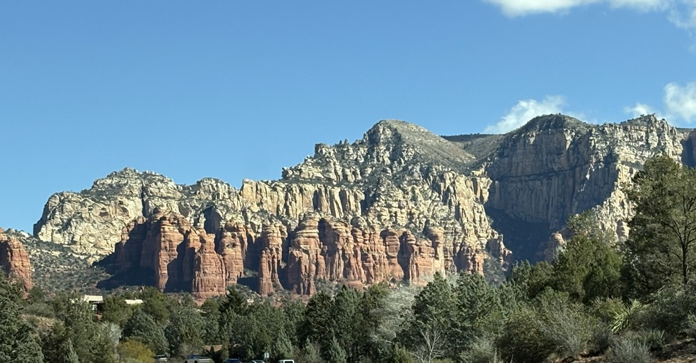 Craig Spiesman photo featuring rugged cliffs with red rock columns and pale mountain faces