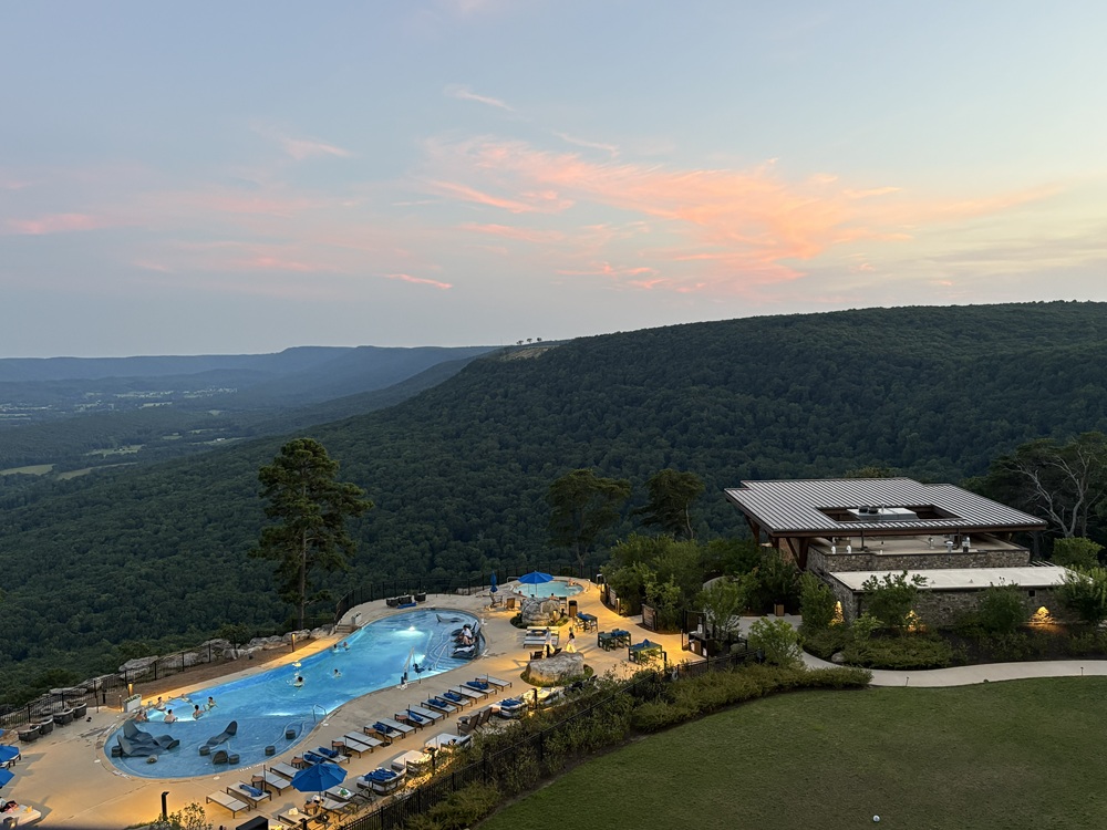Craig Spiesman photo featuring an outdoor swimming pool with forested hills beyond