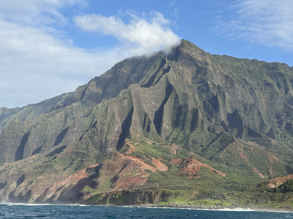 Craig Spiesman photo featuring steep mountain ridges beside blue ocean water